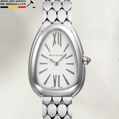 an image of a woman ' s wrist watch with roman numerals on it
