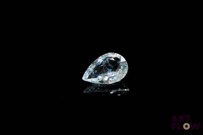 a close up of a diamond on a black surface