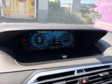 the dashboard of a car with a digital display in the center