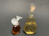 a small glass bottle and a small glass bottle on a table