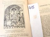 an open book with a piece of paper on top of it