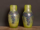 two vases that are sitting on a table