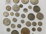 a lot of coins that are on the table