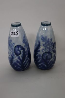 two blue and white vases with numbers on them