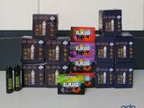 several boxes of eli liquids sitting on top of a counter