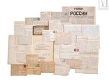several old papers and letters are stacked on top of each other
