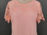 a woman ' s pink top on a mannequin mannequin mannequin mannequin mannequin mannequin mannequin mannequin