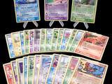 several pokemon cards are arranged in a row on a black background