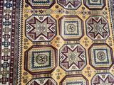 an oriental rug with many different colors and patterns on it