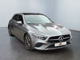 the mercedes cla is parked in a room with a white wall