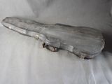 a guitar case that is sitting on a white sheet