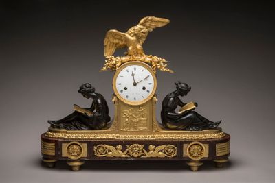 a clock that is sitting on top of a table