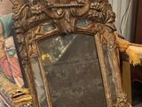 a picture of a chair with a mirror on top of it