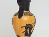 a black and yellow vase on a white background