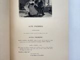 an open book with a picture of a man and a woman sitting on a bench