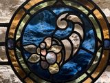 a stained glass window with a fish in it