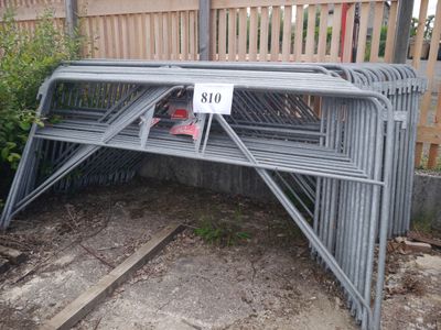 a metal bench with a sign on it in the yard