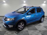 the blue dacia is parked in a room with a checkered floor
