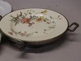 two plates and a bowl sitting on a table