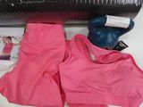a pink sports bra top and a pair of blue boxing gloves