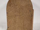 an image of a small wooden bookend with dots on it