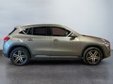 the mercedes gle suv is parked in a showroom