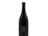a bottle of wine that is sitting on a table