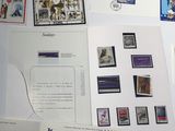 a lot of stamps on a table with a picture on it