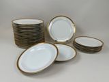 a lot of plates that are sitting on the table