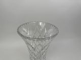 a glass vase that is sitting on a table