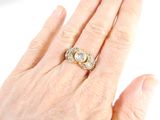 an image of a woman ' s hand with a diamond ring on it