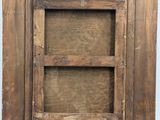 a close up of a wooden frame with a window on it