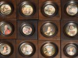 many plates with different pictures of people on them