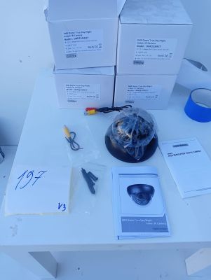 a table with a bunch of boxes on it and a pair of scissors on it