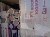 many rolls of insulation sitting in the back of a truck