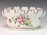 a white bowl with a floral design on it