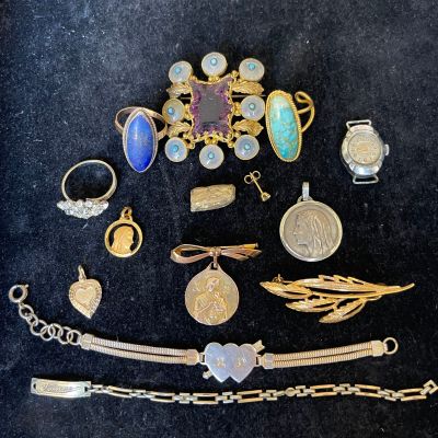 several different types of jewelry are displayed on a black surface