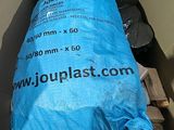 a bag of plastic sitting inside of a cardboard box