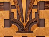 an art deco design on the wall of a building