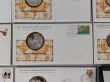 several different stamps are on a table with a picture of a man