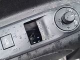 a close up of a car ' s dashboard with a button