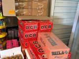 several boxes of beer are stacked on top of each other on a table