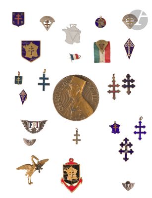a lot of different types of religious pins on a white background