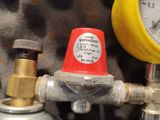 a close up view of a pressure gauge and a pressure gauge