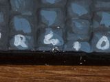 a painting of a sign on a wooden table