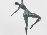 bronze sculpture of a female dancer on a marble base