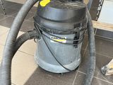 a vacuum that is sitting on the floor in the room