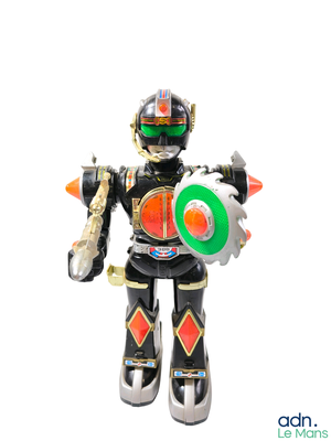 a toy robot that is holding a frisbee in his hand