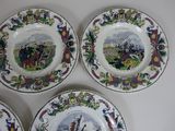 three plates with different designs on them on a white surface