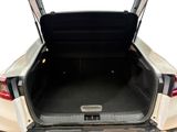 the back of a car with its trunk open showing the cargo compartment